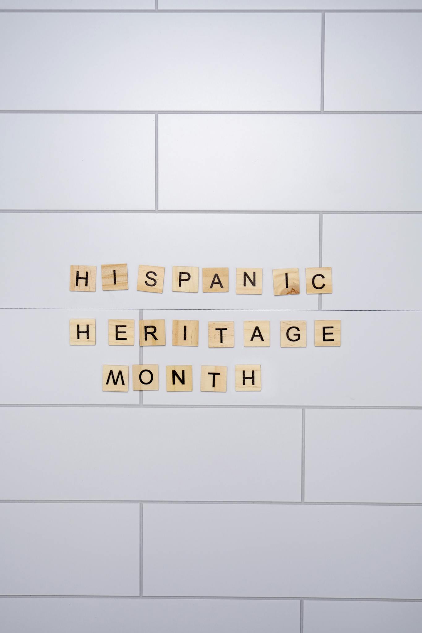 Tile letters spelling 'Hispanic Heritage Month' on a white background.